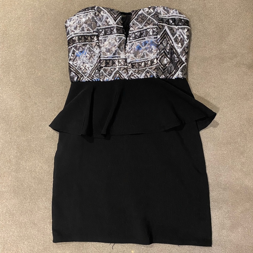 Woman’s Sequenced Peplum Dress